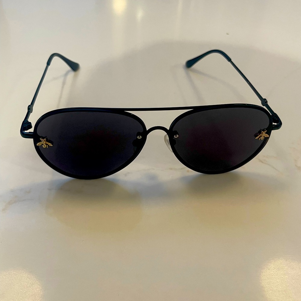 Adorable black aviators with gold hardware.